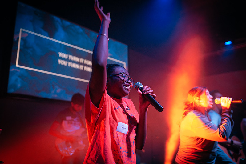 young-student-raising-hand-leading-worship-coastal-youth-parkland